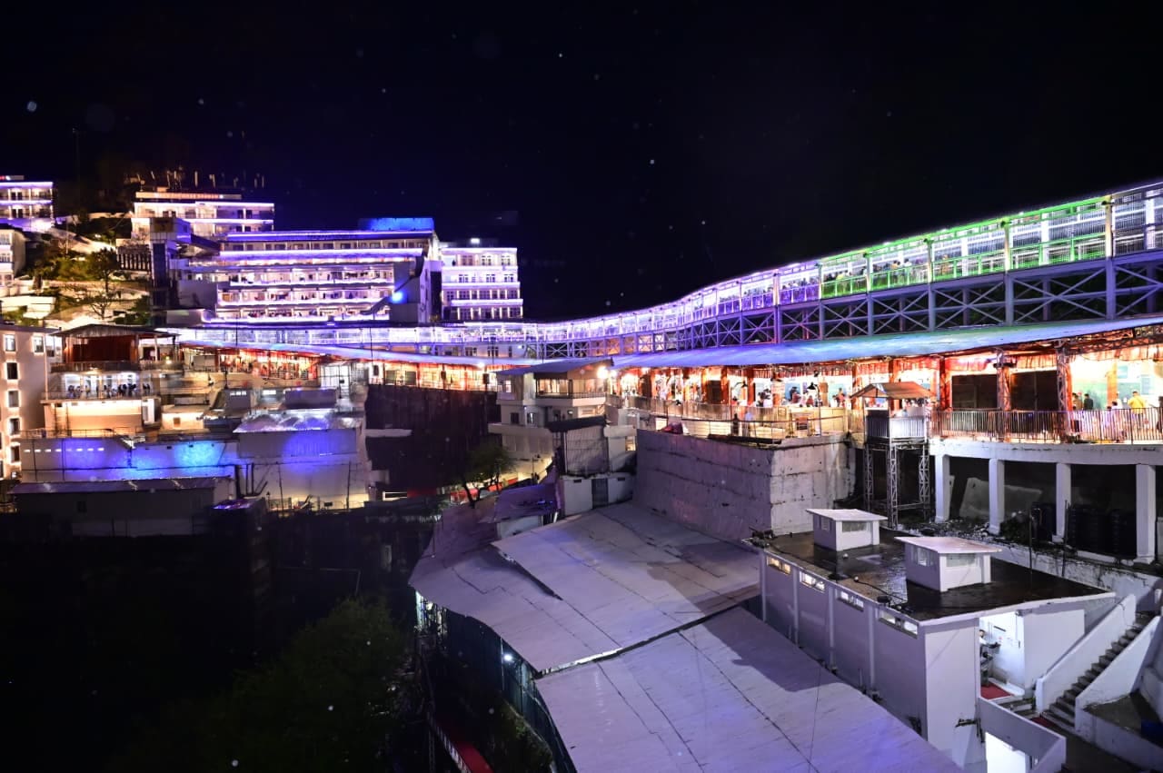 The Bhawan complex lit up at night
